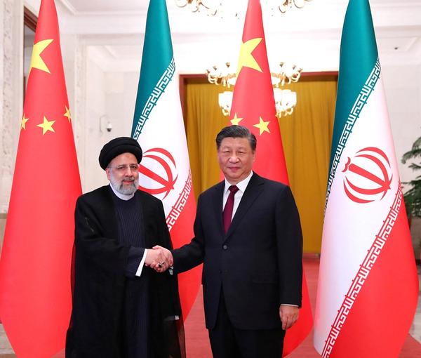 Iranian President Ebrahim Raisi shakes hands with Chinese President Xi Jinping during a welcoming ceremony in Beijing, China, February 14, 2023.