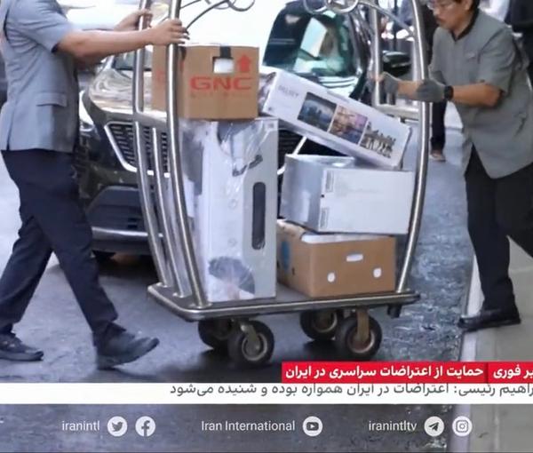 Trolleys of luggage belonging to Iran’s President Ebrahim Raisi’s entourage being loaded on a truck in front of the Millennium Hilton hotel in New York on September 23, 2022