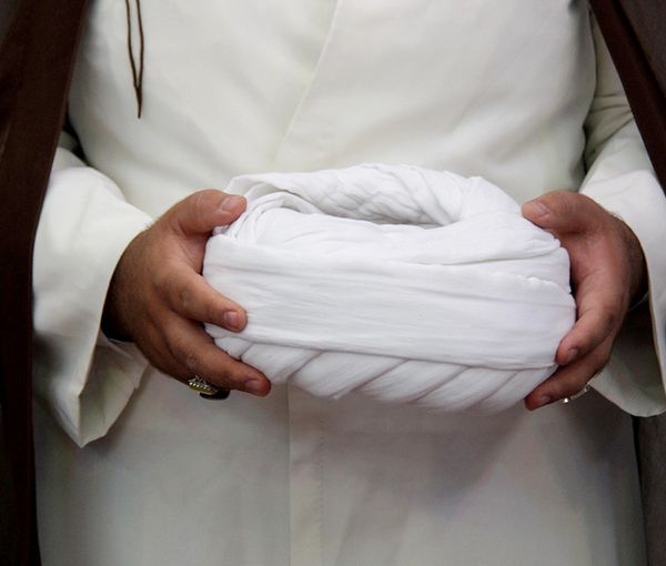 A cleric holding his turban  (file photo)