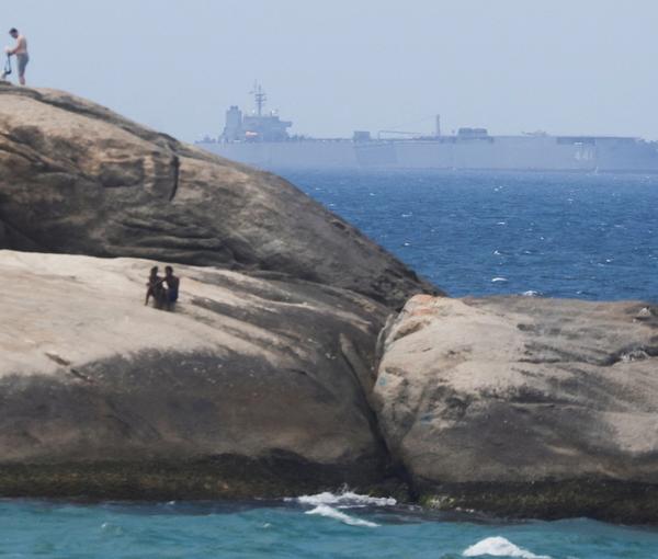 Iranian military ship Iris Makran navigates on the coast of Rio de Janeiro as beachgoers sunbathe on the stones of Arpoador Beach, Brazil, February 27, 2023.