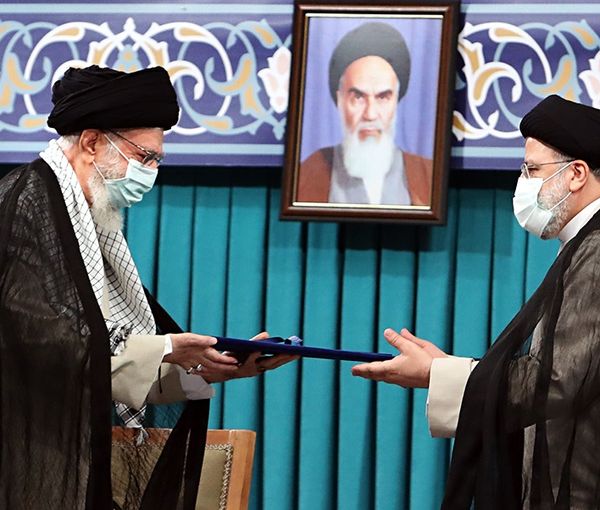 Raisi receiving his presidential approval document from Iran's ruler Ali Khamenei. August 3, 2021