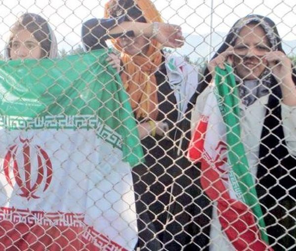 Women held behind the fences, not allowed to enter the stadium to watch a match. March 29, 2022