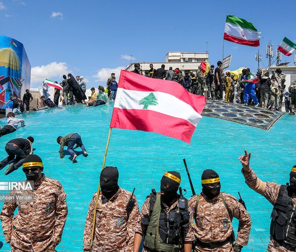 Islamic Republic’s supporters holding Lebanese flag in the capital Tehran during Quds day rallies on April 14, 2023 