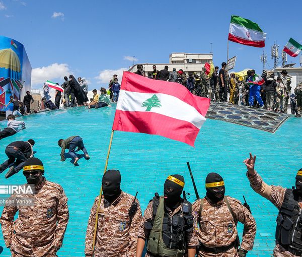 Islamic Republic’s supporters holding Lebanese flag in the capital Tehran during Quds day rallies on April 14, 2023