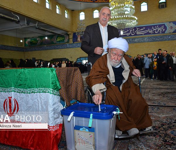 A cleric casting his vote during the parliamentary elections in the city of Qazvin in March 2020