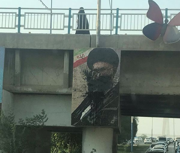 A Khamenei poster defaced with black paint in Iran in October 2022