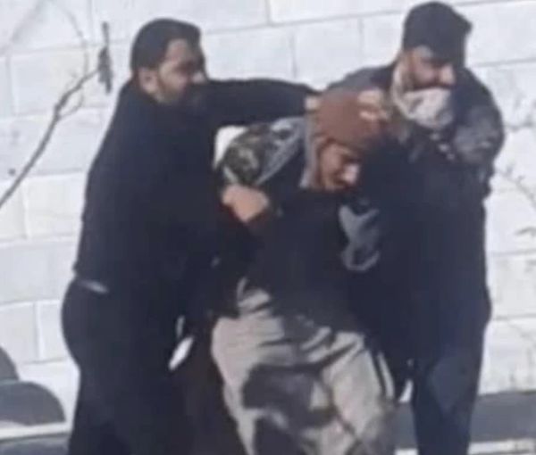 Plainclothes agents arresting a protester in Zahedan on January 27, 2023