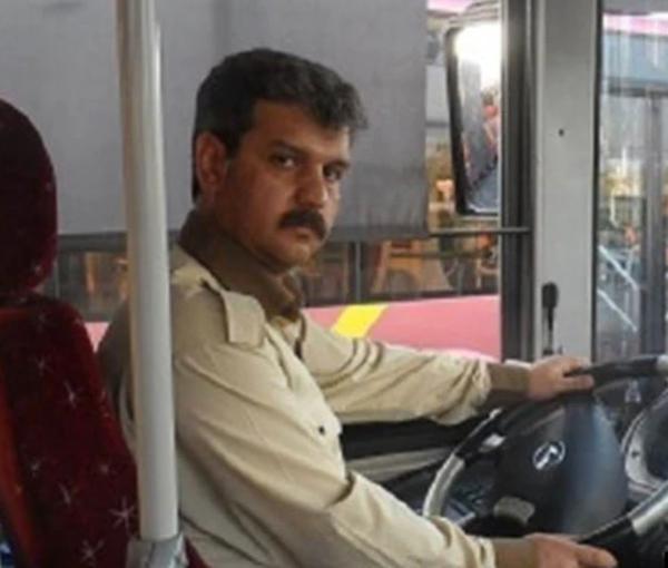 Reza Shahabi driving a city bus in Tehran. Undated