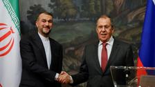 Russian Foreign Minister Sergei Lavrov shakes hands with Iranian Foreign Minister Hossein Amir-Abdollahian during a news conference following their meeting in Moscow, Russia March 29, 2023. 
