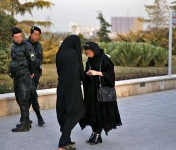 A hijab enforcer team confronting a woman on streets   (file photo)