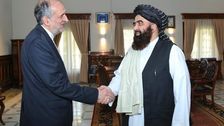 Iranian envoy Bahador Aminian meeting with a Taliban leader. Undated