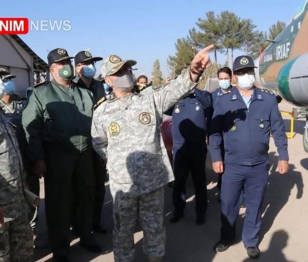 Photo published by Tasnim news agency showing Iranian officers looking at a Sukhoi 24 warplane allegedly fitted with a cruise missile. December 15, 2021