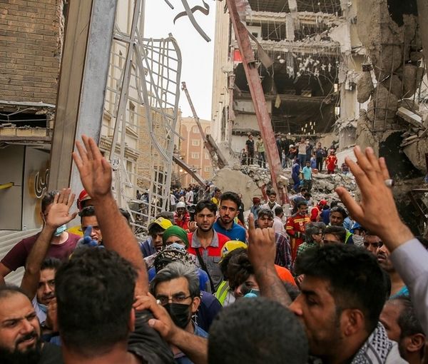 Ordinary people anxiously trying to help rescue operations where a building collapsed in Iran. \Msy 25, 2022