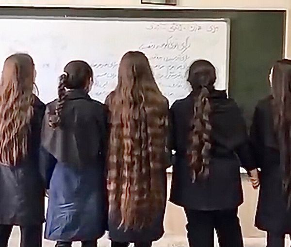 High school female students have removed their hijab in class and written slogan on the board. Oct 3, 2022