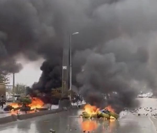 Protesters block roads in the Kurdish city of Sanandaj as security forces advance on Nov. 17, 2022