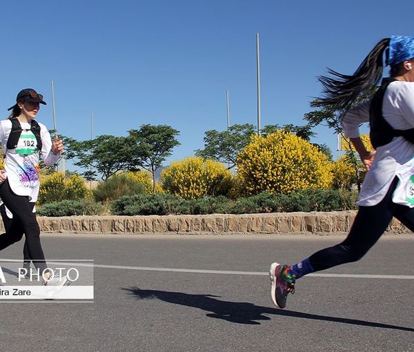 Two women running at a marathon race in Shiraz (May 5, 2023)