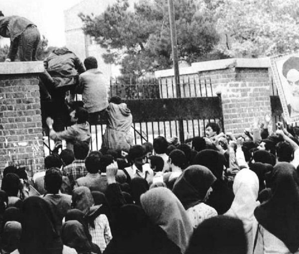 Radical students climbing the wall of the US embassy in Tehran. November 4, 1979