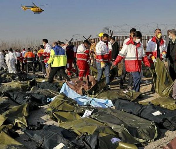 Bodies of victims on the ground at the crash site near Tehran on January 8, 2020