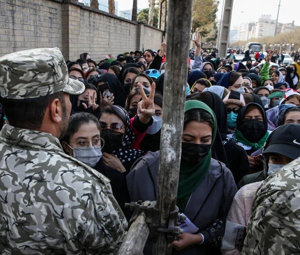 Security forces barring women from entering the football stadium in Mashhad. March 29, 2022