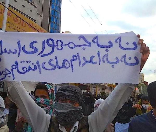 An Iranian holding a banner against the regime’s executions during a protest rally in the city of Zahedan  (undated)