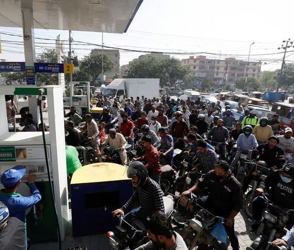 People on motorcycles wait for their turn to get petrol at a petrol station, after Pakistan Petroleum Dealers Association (PPDA) announced a countrywide strike, in Karachi, Pakistan, November 25, 2021.