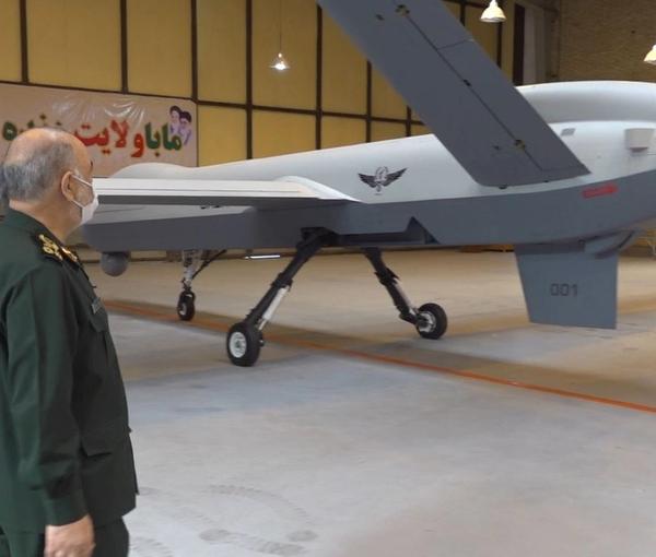 IRGC commander Hossein Salami looking at an Iranian-made drone