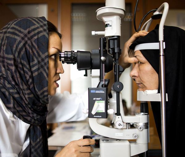 An Iranian ophthalmologist examining a patient (file photo)