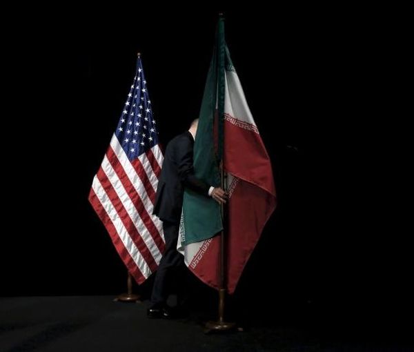 US and Iran flags at JCPOA nuclear talks in 2015