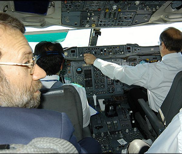 Iran’s parliament speaker Mohammad-Bagher Ghalibaf (right) in a cockpit of a plane and former Speaker of the Parliament Ali Larijani (left) (undated)