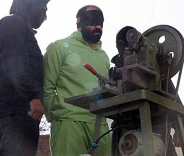 A prisoner about to be amputated by a guillotine-like device (file photo)