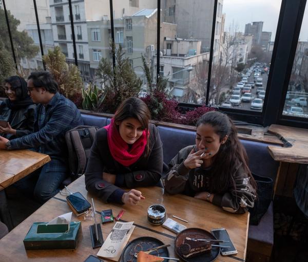 Young women in a Tehran cafe, defying obligatory hijab. January 29, 2023