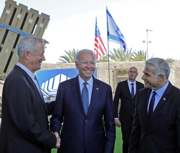 President Joe Biden with Yair Lapid (R) and Defense Minister Benny Gantz in Israel in July
