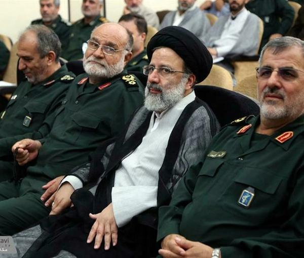 An undated photo showing Iranian President Raisi with IRGC commanders