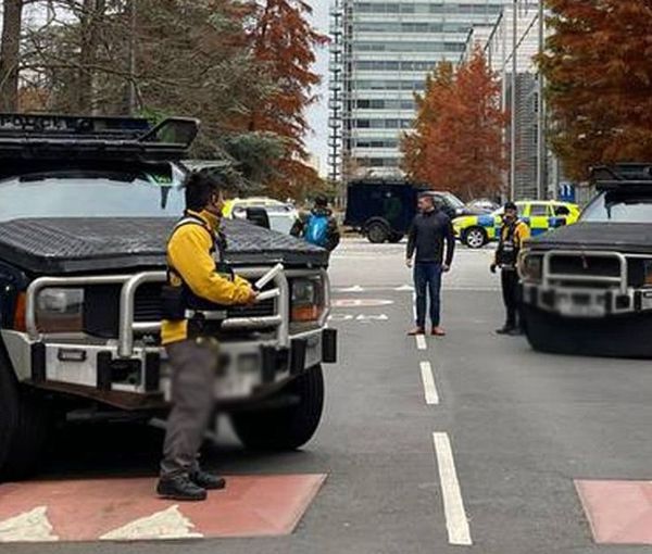 Armored police vehicles are seen outside the headquarters of Iran International on November 19, 2022