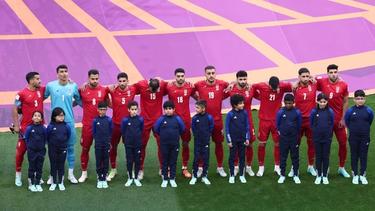 Iranian players line up during the national anthems before the match against England on November 21, 2022.