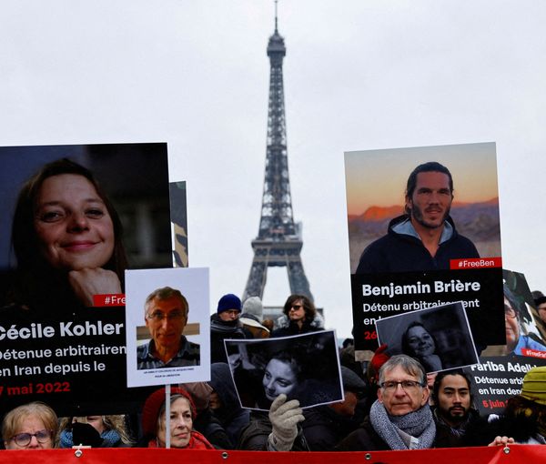 Supporters and relatives of French citizens detained in Iran, gather in front of the Eiffel Tower, Jan. 23, 2023