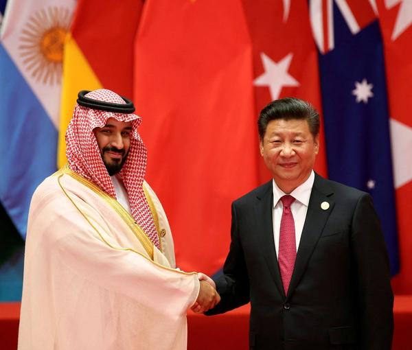 FILE PHOTO: Chinese President Xi Jinping with Saudi Arabia's Crown Prince Mohammed bin Salman during the G20 Summit in China September 4, 2016.