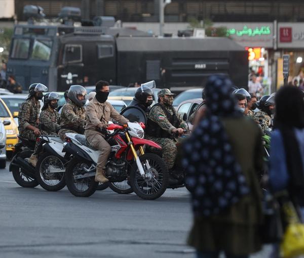 Iranian riot police and plainclothesmen on their typical bikes in Tehran, on Oct. 3, 2022