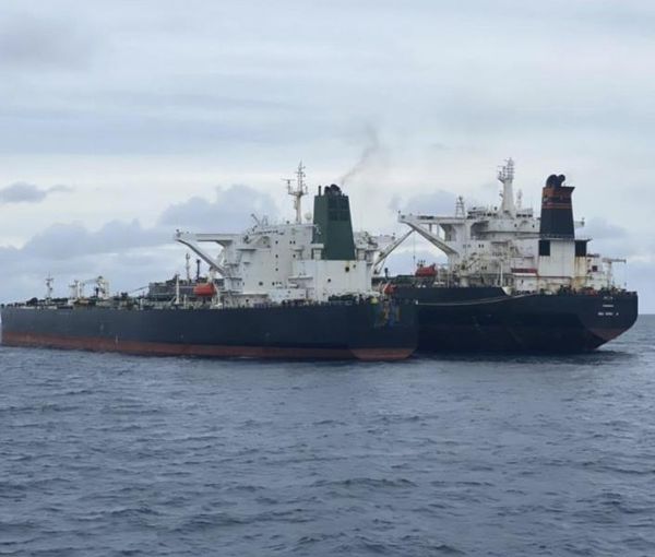 An undated photo showing a ship-to-ship oil transfer