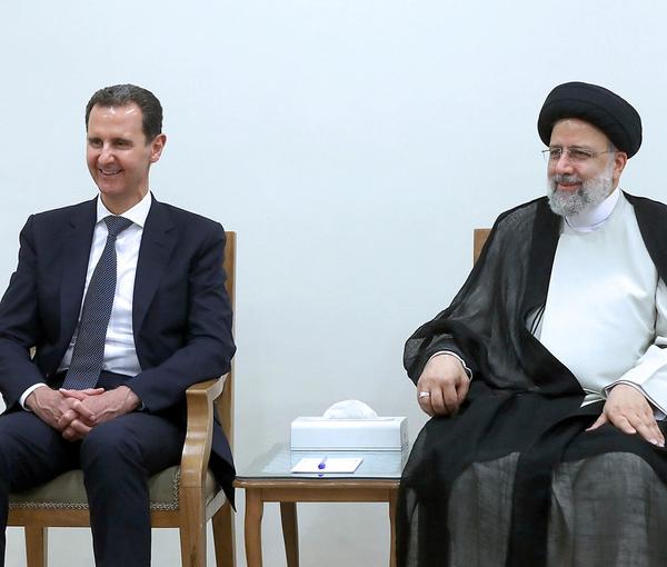 Syrian President Bashar Assad (left) and his Iranian counterpart Ebrahim Raisi during a meeting in Tehran on May 8, 2022