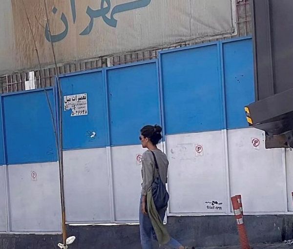 A woman walking in Tehran without a headscarf on Wednesday or Thursday, Spet. 28 or 29, 2022