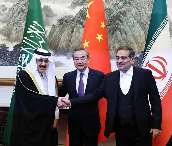 Wang Yi, China’s chief diplomat, Ali Shamkhani (R), Iran’s national security chief, and Saudi representative Musaad bin Mohammed Al Aiban in Beijing, March 10, 2023
