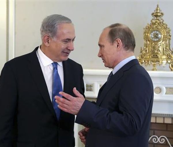 Russian President Vladimir Putin (right) meets with Israeli Prime Minister-Designate Benjamin Netanyahu